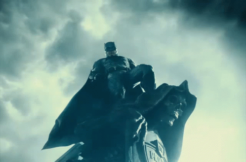 Batman Statue On Justice League Logo GIF