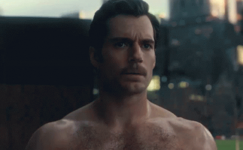 Batman Superman And Wonder Woman Are Standing Next To Each Other In Front Of A Cloudy Sky GIF