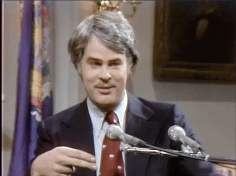 Batting Eyelashes Dan Aykroyd Smile GIF