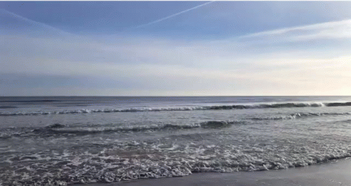 Beach Scene With Waves And Blue Sky GIF