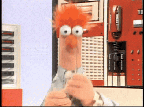 Beaker From The Muppet Show Is Holding A Pen GIF