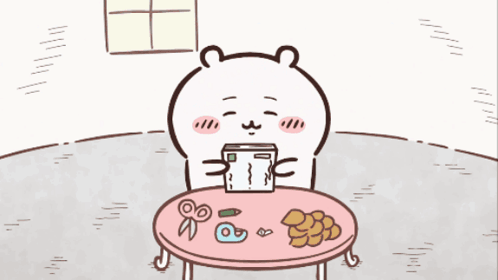 Bear Sitting At Table Holding Box GIF
