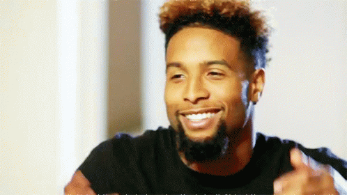 Bearded Curly Haired Man Smiling Thumbs Up