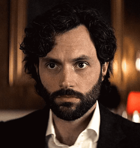 Bearded Curly Man in Suit and White Shirt