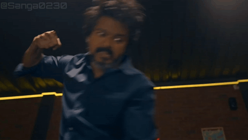Bearded Man Arms Outstretched In Dark Room GIF
