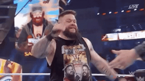 Bearded Man Arms Outstretched Making Face Wrestling Ring