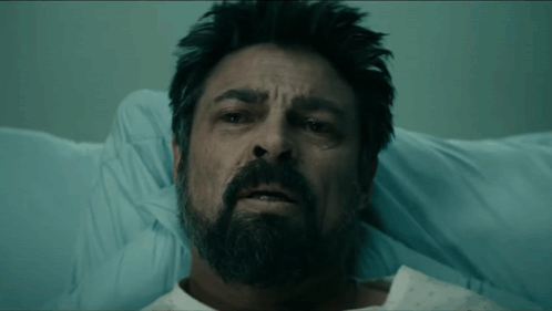 Bearded Man Asleep in Hospital Bed