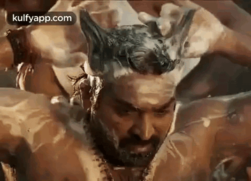 Bearded Man Bathing With Foam on Head