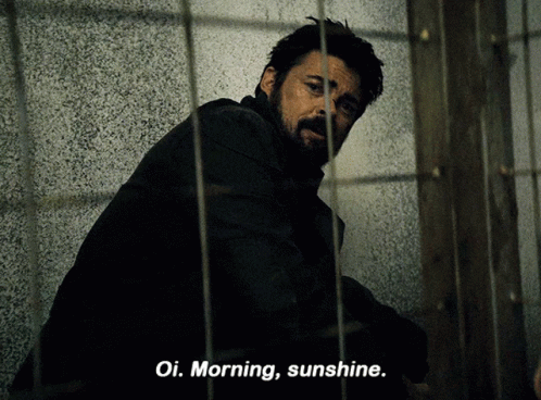 Bearded Man Behind Bars Saying Oi Morning Sunshine