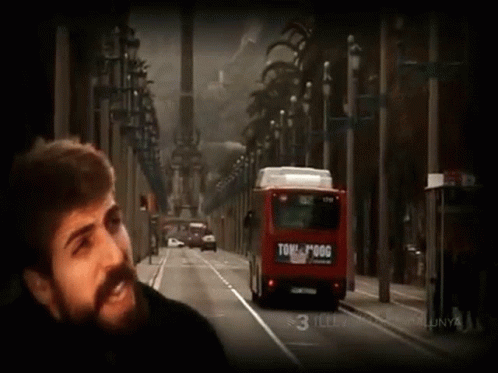 Bearded Man Beside Red Bus Saying Tome Pogg GIF
