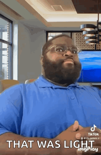 Bearded Man Blue Shirt Glasses Says That Was Light