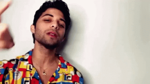 Bearded Man Colorful Shirt And Necklace GIF