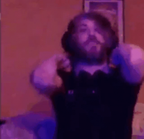Bearded Man Dancing in Bow Tie and Headphones