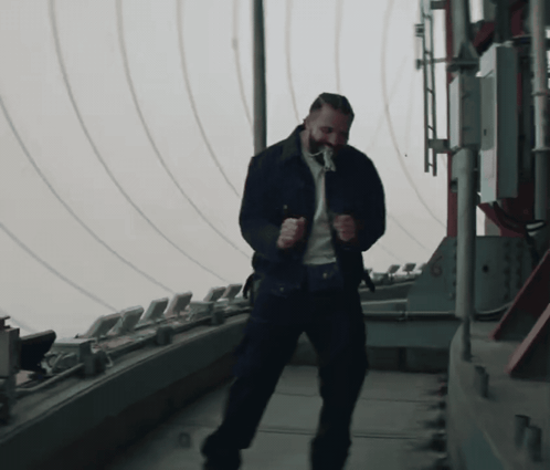 Bearded Man Dancing on Roof
