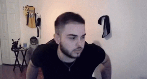 Bearded Man Doing Push Ups Next To Basketball Jersey GIF