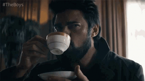 Bearded Man Drinking Cup
