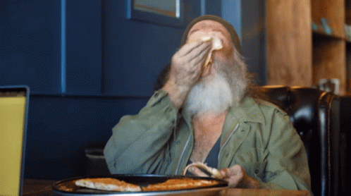 Bearded Man Eating Pizza