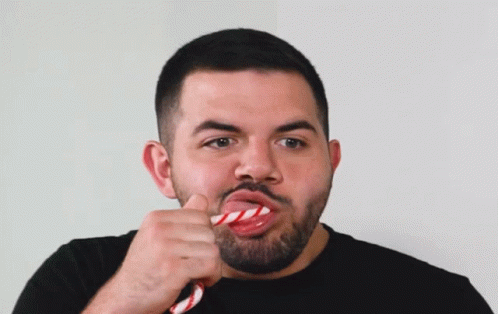 Bearded Man Eating Red and White Candy Cane
