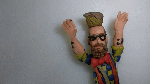 Bearded Man Figurine With Sunglasses And Red Bow Tie GIF