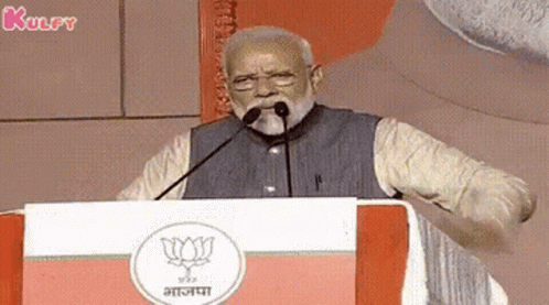 Bearded Man Giving Speech With Microphone In Mouth At Podium GIF