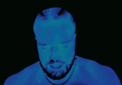 Bearded Man Glowing in Darkness