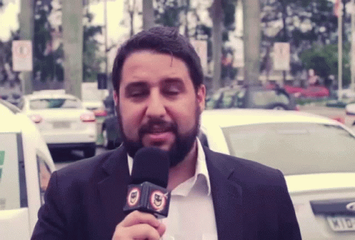 Bearded Man Holding BD Microphone