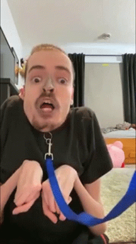Bearded Man Holding Blue Leash GIF