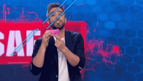 Bearded Man Holding Condom in Front of Sale Sign