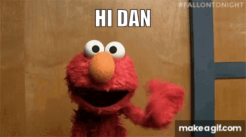 Bearded Man Holding Flowers in Front of Onlydans.com Sign