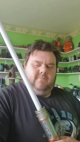Bearded Man Holding Light Saber GIF