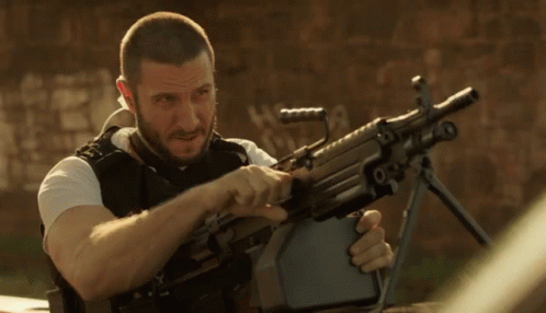 Bearded Man Holding Machine Gun With Letter R