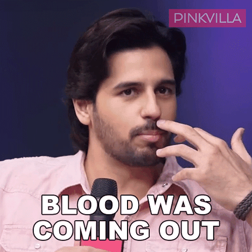 Bearded Man Holding Nose In Front Of Pinkvilla Logo GIF