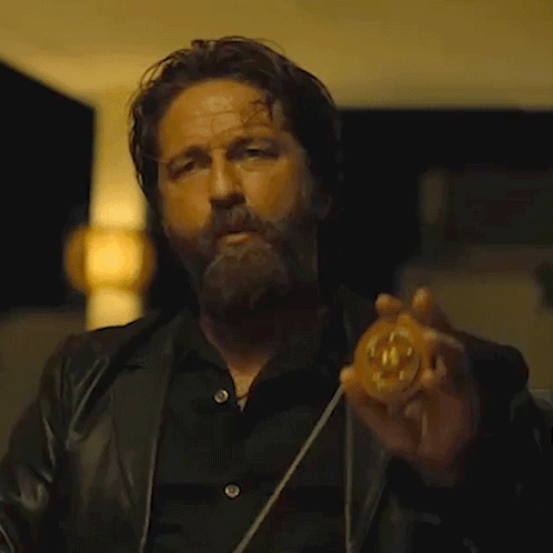 Bearded Man Holding Number 10 Coin