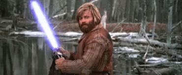 Bearded Man Holding Purple Lightsaber