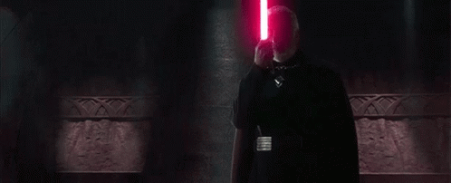 Bearded Man Holding Red Lightsaber