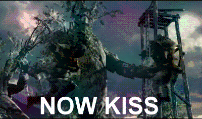 Bearded Man Holding Statue Saying Now Kiss