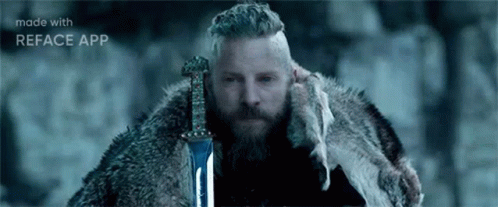 Bearded Man Holding Sword In Snow GIF