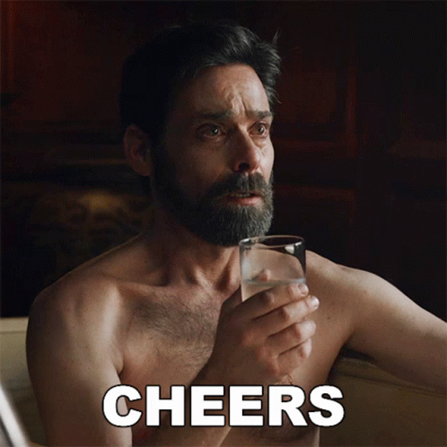 Bearded Man Holding Water Cheers
