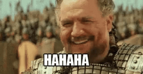 Bearded Man in Armor Laughing Before Crowd