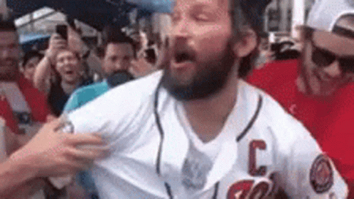 Bearded Man in Baseball Jersey in Front of Crowd