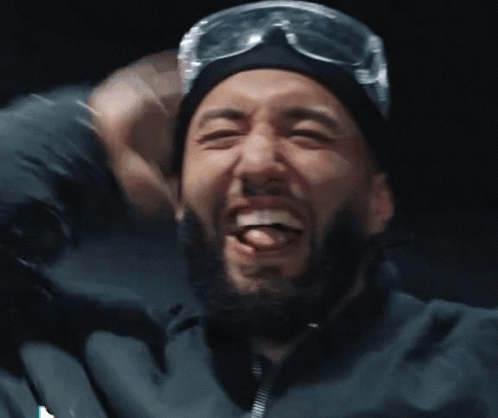 Bearded Man in Beanie and Goggles Laughs