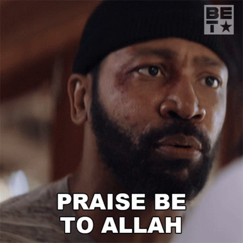 Bearded Man in Beanie Saying Praise Be to Allah