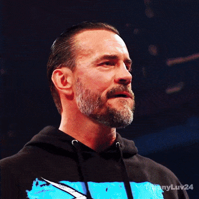 Bearded Man in Black Hoodie With Blue Design
