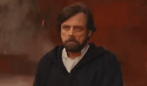 Bearded Man in Black Jacket Gesturing