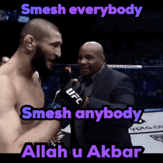 Bearded Man In Black Shirt Looking At Camera GIF