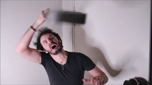 Bearded Man in Black Shirt Throwing Something