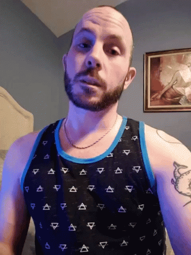 Bearded Man in Black Triangle Tank Top