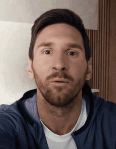 Bearded Man In Blue Jacket Looking At Camera GIF
