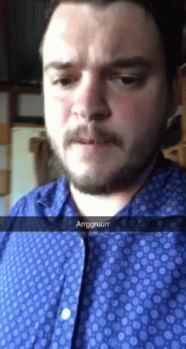 Bearded Man in Blue Shirt Says Arrggruurrr