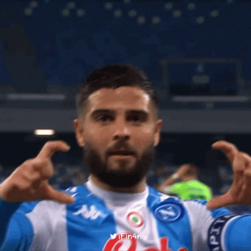 Bearded Man in Blue White Jersey With N